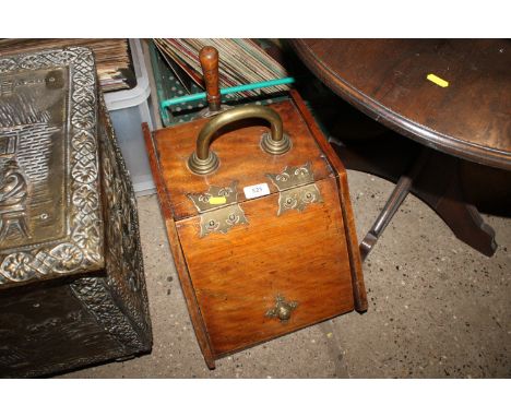 A 19th Century mahogany and brass mounted coal scuttle and shovel 