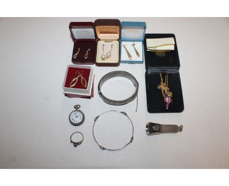 A box of jewellery top include silver snap bangle; four pairs of yellow metal earrings; a 925 silver gilt pendant hung to a f
