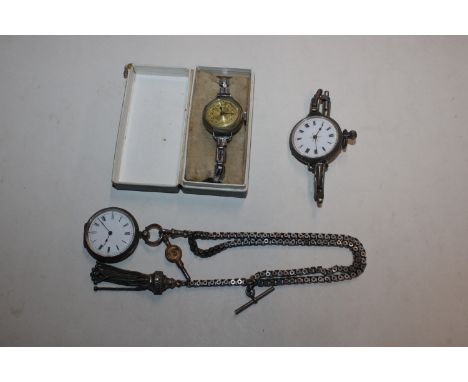 A silver cased fob watch on expanding strap; another silver cased fob watch on chain with T bar; and a vintage wrist watch