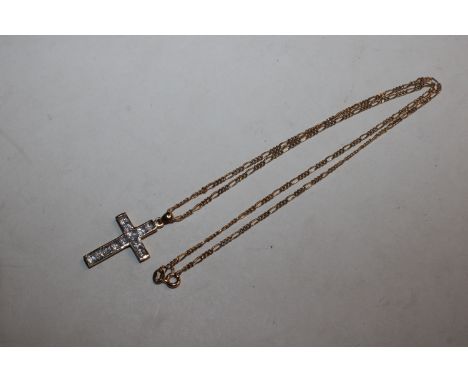 A 9ct gold crucifix pendant set with white stone hung to 9ct gold chain, 6.5gms total weight 