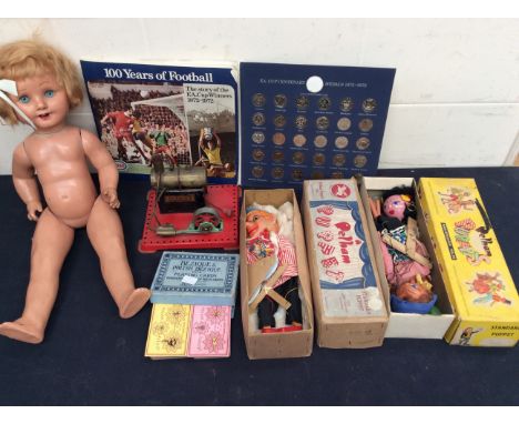 Three Pelham boxed puppets, Mamod steam engine doll and card game.