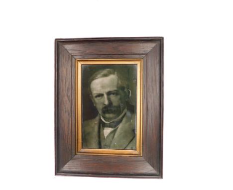 A George Cartlidge ceramic tile of a gentleman, possibly David Lloyd George, within wooden frame (back not visible).  Conditi