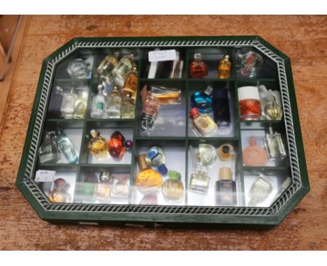 A collection of thirty-nine  miniature and sample perfume bottles, comprising vintage and later examples, various Guerlain bo