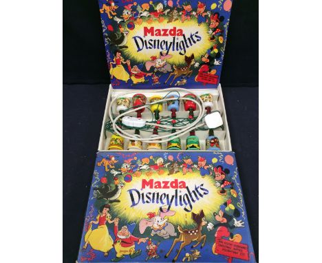 A boxed set of vintage Mazda Disney lights.