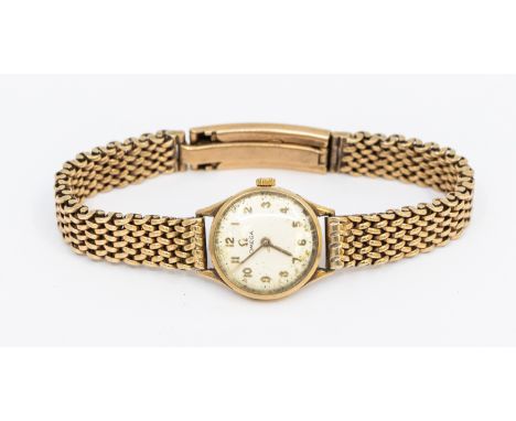 Omega- a ladies vintage 9ct gold Omega wristwatch, comprising a round signed silvered dial with gilt Arabic makers, case appr