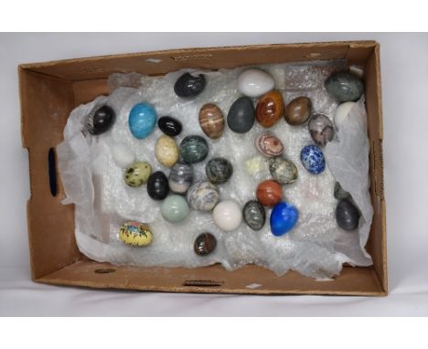 A collection of various stone eggs and spheres to include marble, agate, amazonite, leopard stone, orthoceras along with cera