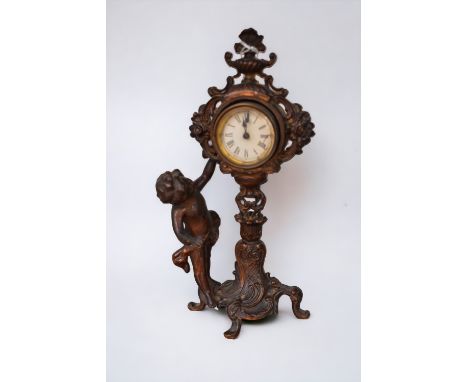 An early 20th century French spelter mantel clock with putti detail.