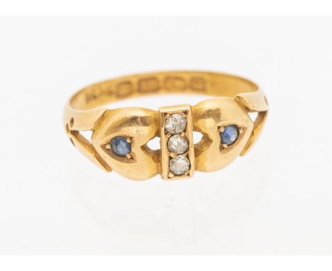 A Victorian sapphire and diamond 18ct gold ring, Birmingham 1894, the heart details set with sapphires with a central row of 