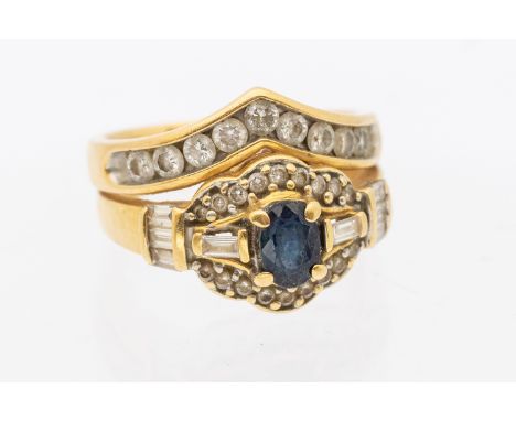 A sapphire and diamond  18ct gold ring with an attached diamond set wishbone, width approx 14mm, size O, total gross weight a