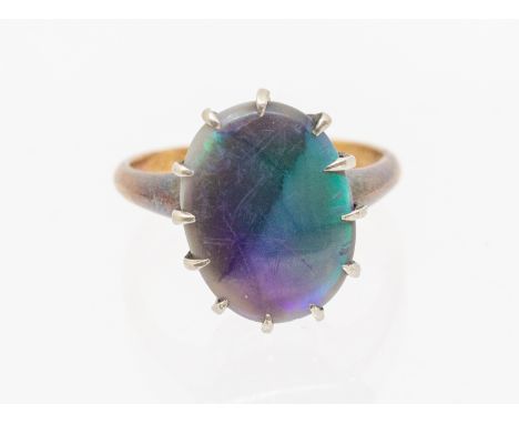 An opal doublet 18ct gold ring, comprising an oval opal doublet, length approx 14 x 10mm, size M, total gross weight approx 3