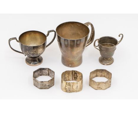 A collection of silver items to include; an Elizabeth II silver christening mug of stylish modernist shape, engraved "Paul, 3