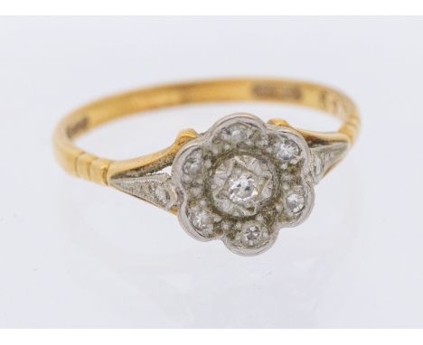 A diamond and 18ct gold cluster ring, flower cluster grain set with small diamonds, width approx 6mm, size O1/2, total gross 
