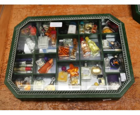 A collection of thirty-nine miniature and sample perfume bottles and samples, comprising vintage and later examples, includin