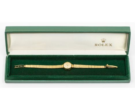 Rolex: a Ladies 9ct gold vintage Rolex wristwatch, comprising a round silvered signed dial with applied gold baton markers, c