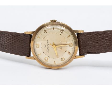 A gents vintage 9ct gold Smith Imperial wristwatch, circa 1950's, comprising a signed champagne dial with applied gilt arrow 