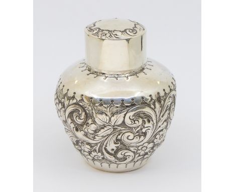 A Victorian silver tea caddy, of globular shape with elaborate floral and foliage repousse design, removable cover, hallmarke