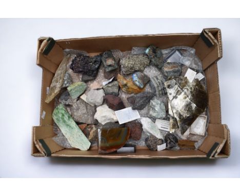 A collection of various rocks and minerals including carborundum, meteorite, tourmaline, boulder opal, chrysocolla, mica, pyr
