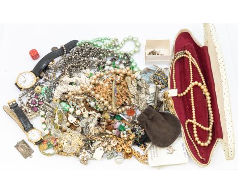 A collection of vintage costume jewellery to include silver charms, faux pearls and beaded necklace, pate set jewellery, ladi