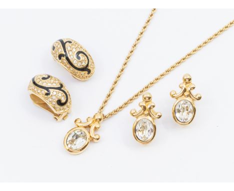 Christian Dior - a gold plated crystal set pendant with scrolled bale, length approx 22mm, suspended from a rope twist chain,
