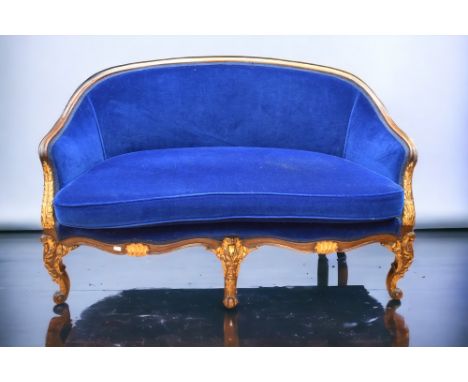 A mid 20th Century Louis XV sofa suite in mahogany and dark blue velvet covering with gilt detail, shell and foliage relief, 