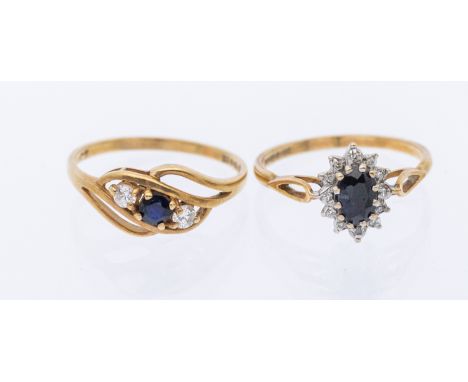 A cz and sapphire 9ct gold three stone ring, size N, along with a diamond and sapphire 9ct gold cluster ring, size Nm combine