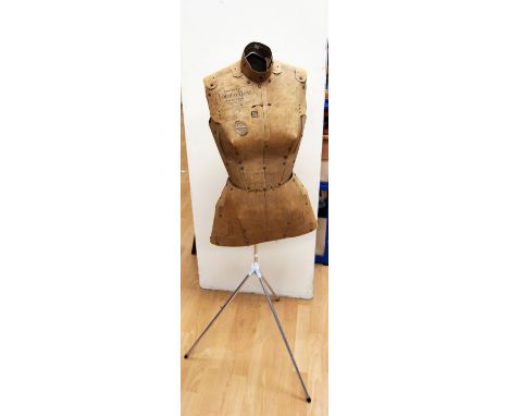 A vintage heavy duty cardboard tailors dummy with measurements printed onto the form, made by Formamatic.