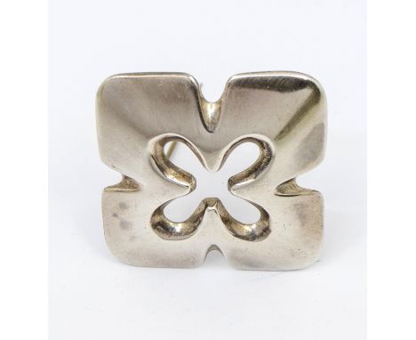 A silver brooch by Ernest A Blyth for Ivan Tarratt, quatrefoil form with pierced floral motif to centre, diameter approx 40mm
