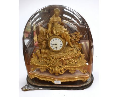 A 19th century gilt brass French mantel clock, with original stand, with pendulum and key. Along with a later early 20th cent