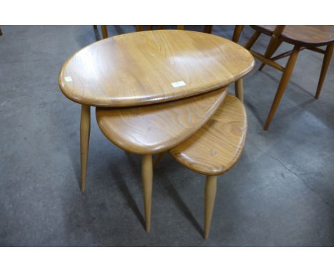 An Ercol Blonde pebble shaped nest of tables 