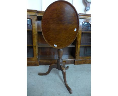 A George III oak circular tilt-top tripod table 