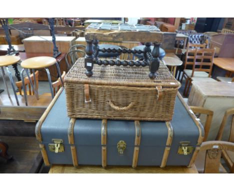 A steamer trunk, stool and a wicker picnic hamper 