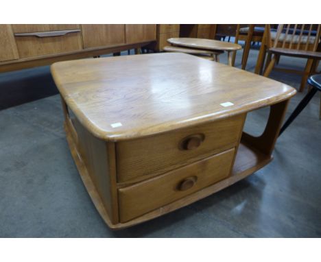 An Ercol Blonde Pandora's Box coffee table 