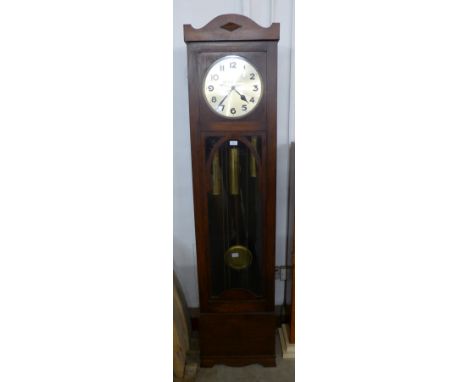 An early 20th Century oak triple weight longcase clock 