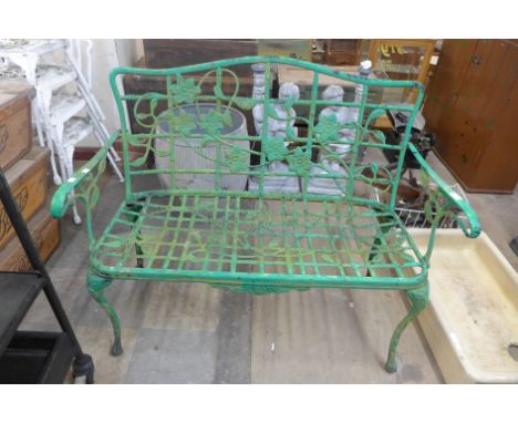 A painted cast alloy garden bench 
