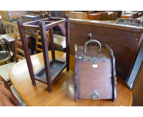 A Victorian walnut and brass coal scuttle and an oak  stick stand 
