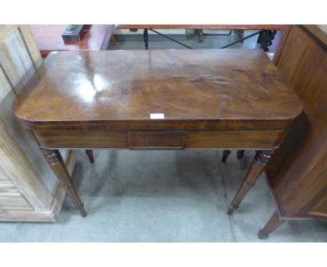 A Victorian mahogany foldover card table 