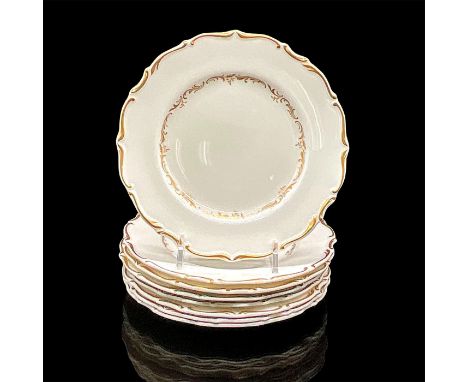 Eight white plates with elegant gold scroll design. Royal Doulton backstamp. Dimensions: 0.5"H x 6.5" diaManufacturer: Royal 