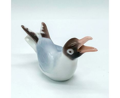 Painted with a light blue and brown glaze. Model number 1809 with a Bing and Grondahl backstamp. Artist: Dahl and JensenIssue