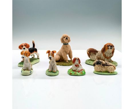 A set of seven dog figures of different species doing different poses. The Basil Mathews figures consist of 2 Pekingese, 1 Co
