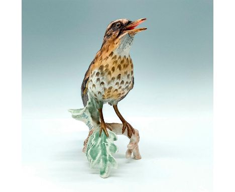 Matte finish, figurine of a Song Thrush bird on a branch speaking. Marked with CV115 and Goebel backstamp. Issued: c. 1960sDi