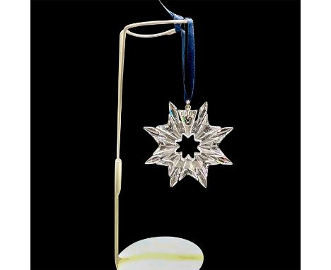 Eight point snowflake raised design on blue satin ribbon with year 2003 tag. 9445 NR 200 301. This item has its original box: