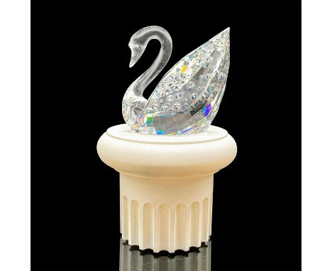 100 Year Anniversary figure. A graceful clear sway with an acrylic white base. Swarovski mark. Certificate of Authenticity in
