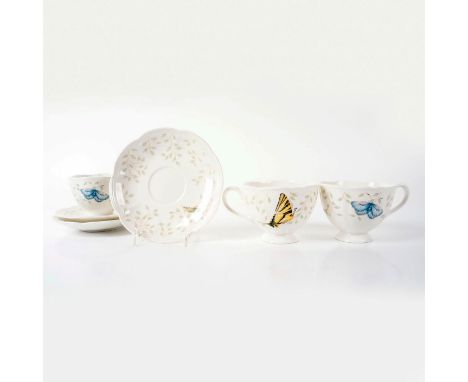 Scalloped edge tableware. Designed with yellow and blue garden bug motif with green leaves. Set includes 3 cups and 3 saucers