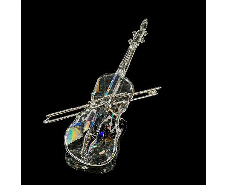 Brilliant clear crystal violin with shiny chrome bow stand. This item has its original box measuring: 6.25"H x 3"D. Violin is