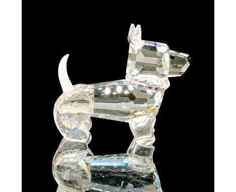 A clear faceted body of a puppy with a frosted tail. Swarovski mark. This item has its original box: 3.25"W x 3.75"H. Artist: