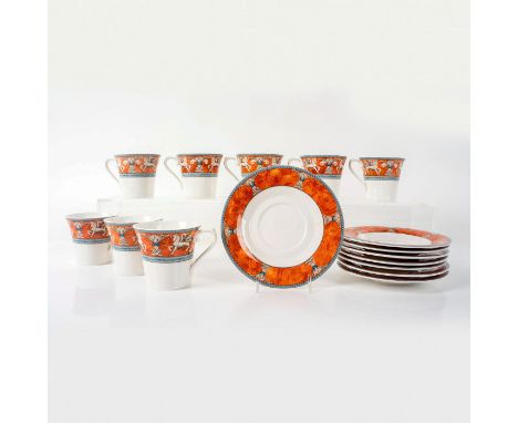 Orange and blue rimmed cups and saucers with winged horses. Mikasa backstamp. Cups measure: 4"L x 3"W x 3"H. Saucers measure: