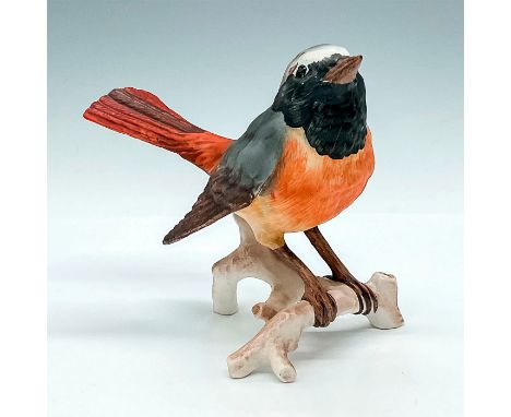 This is a 1975 Goebel bird figurine sitting on a white branch. Goebel factory label, embossed #3813110. Issued: 1975Dimension