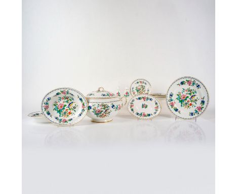 Colorful floral and bird design with gilt edge. Includes soup tureen with lid, 1 plate, 2 saucers, 3 bread and butter plates,