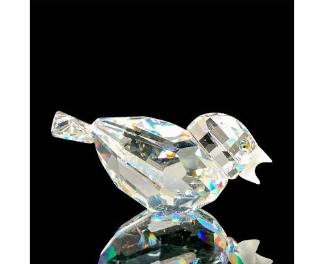A clear faceted bird with tawny eyes and frosted beak. Swarovski mark. This item has its original box: 3.25"W x 2.5"H. Artist