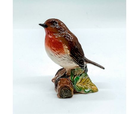 Glazed figure modelled as a brown, red and light tan bird perched on a log. Beswick backstamp. Issued: 20th c.Dimensions: 3"L